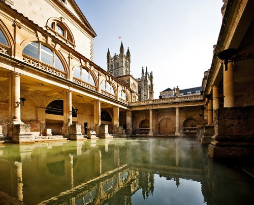 Roman baths with Bath Abbey reflected